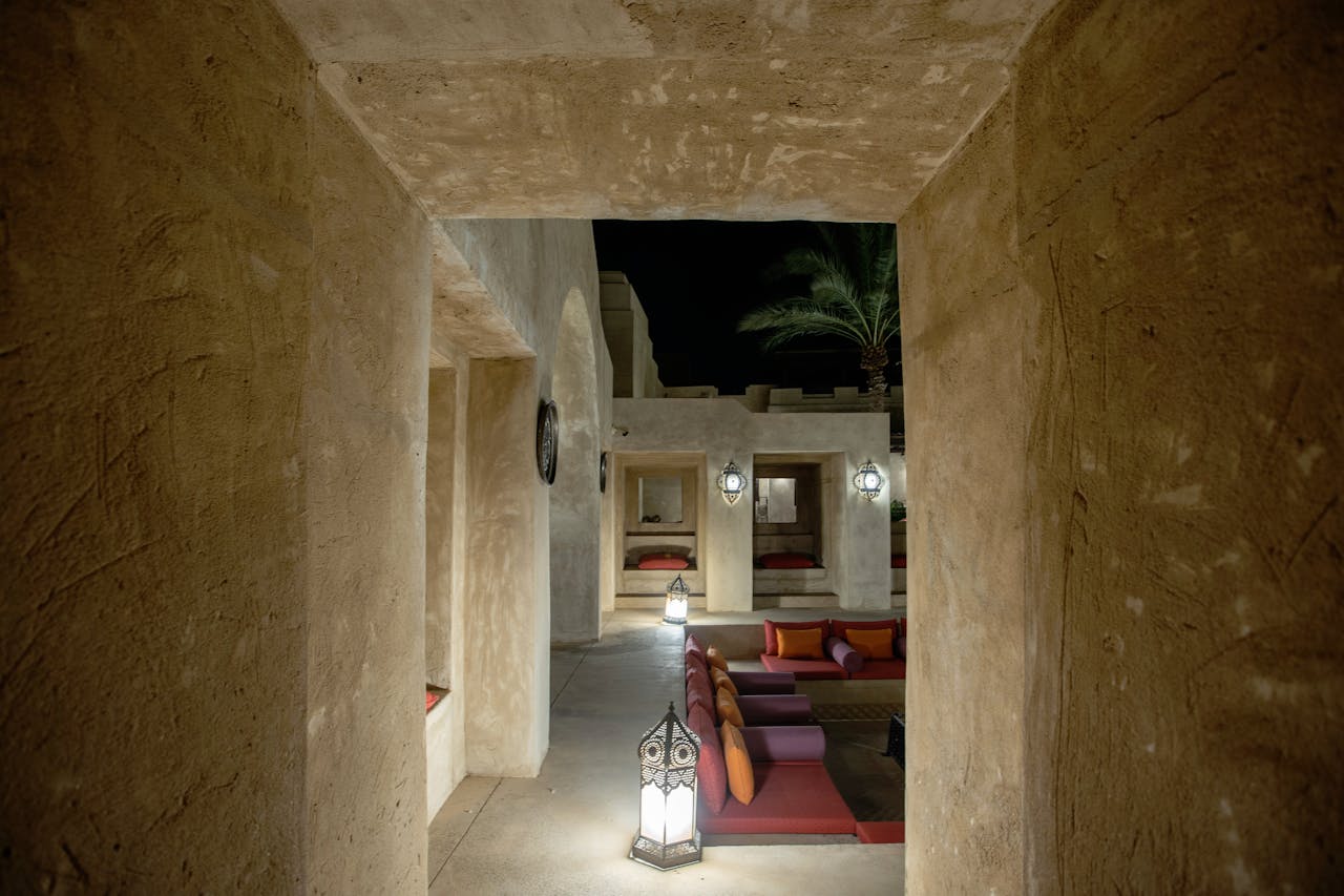 Elegant and luxurious outdoor lounge illuminated by lanterns, capturing the night ambiance in Dubai.